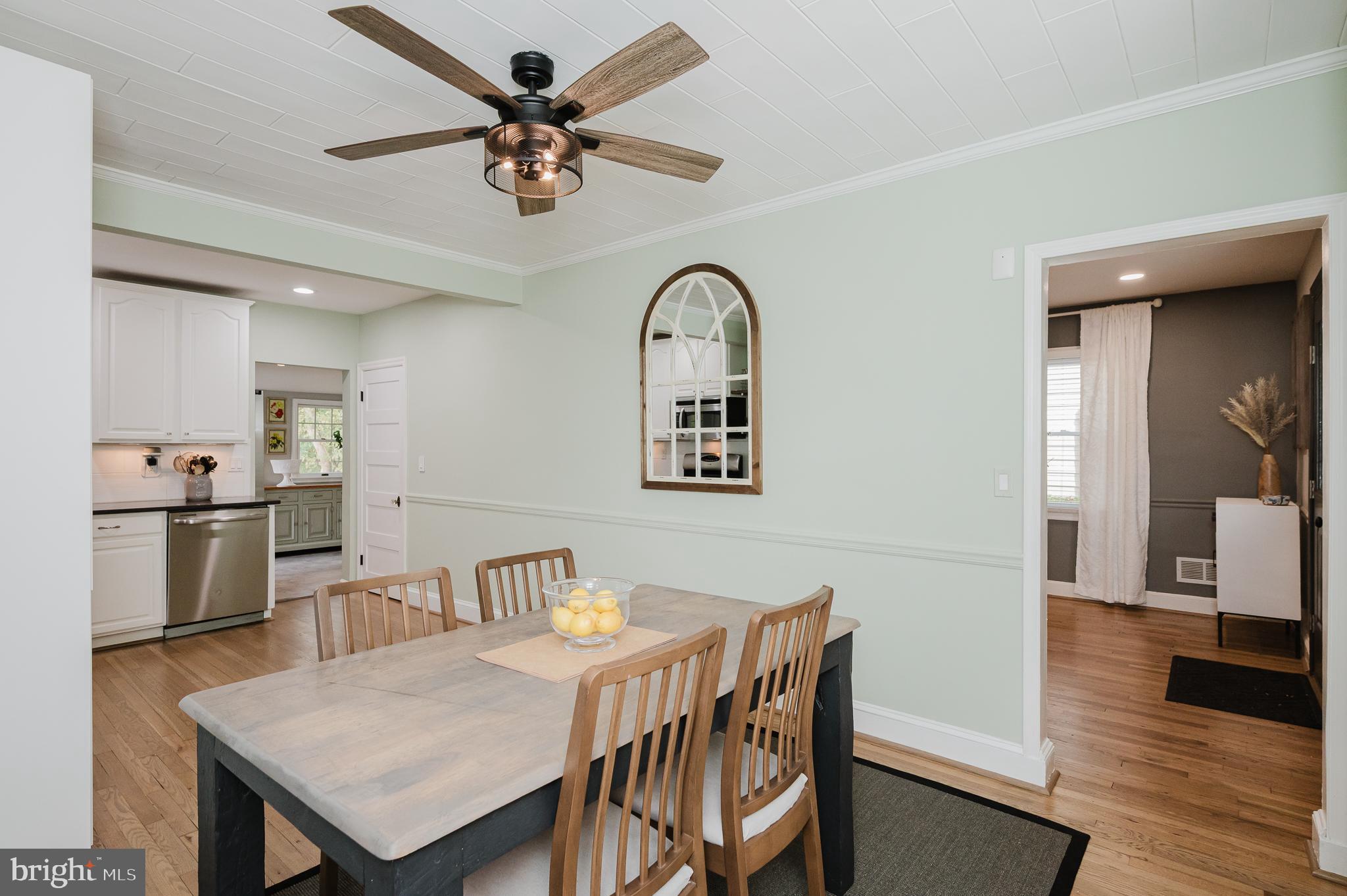 616 Sudbrook Road Baltimore, MD 21208 - Photo 14 of 58 a view of a dining room with furniture and wooden floor
