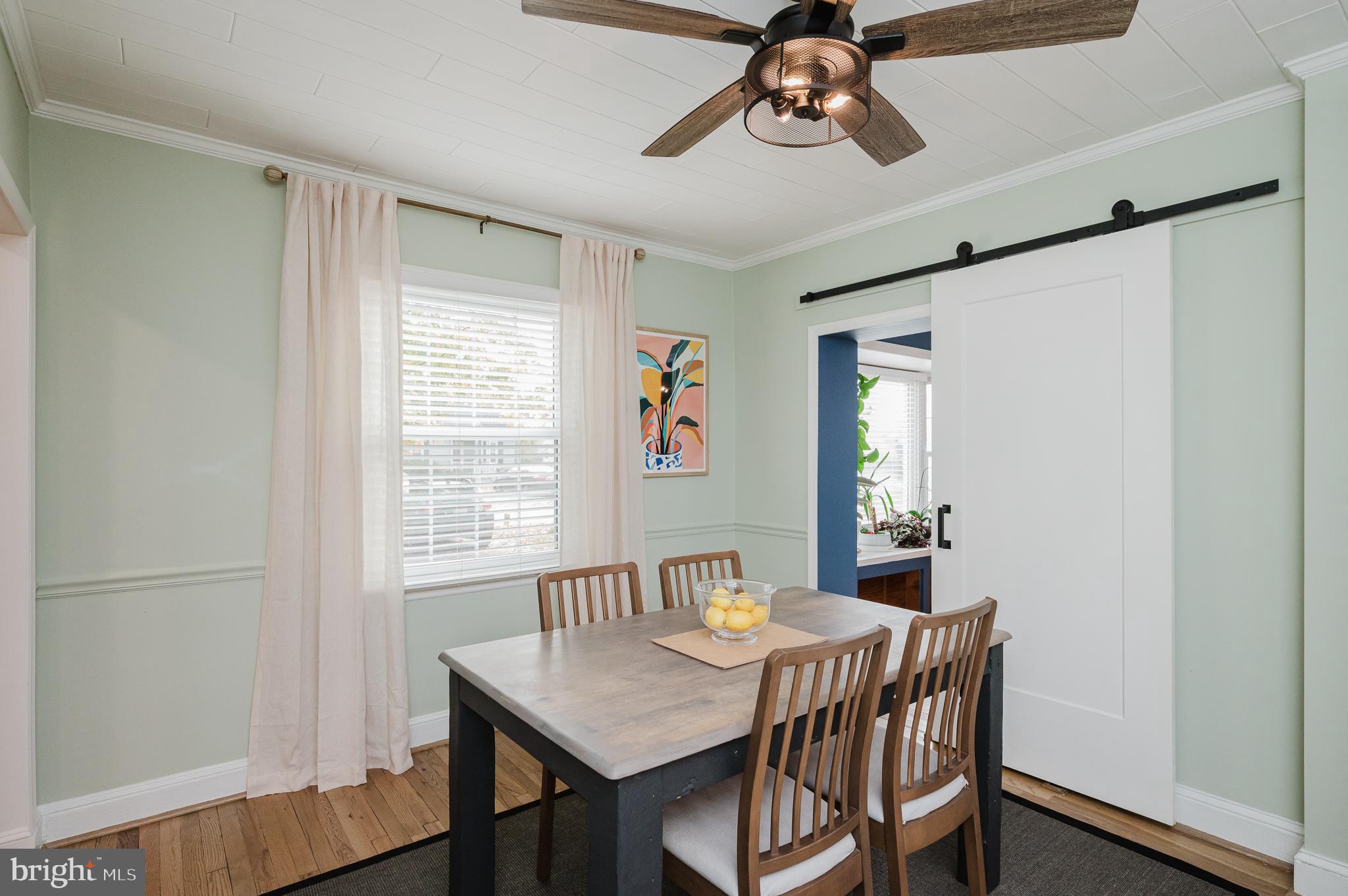 616 Sudbrook Road Baltimore, MD 21208 - Photo 15 of 58 a view of a dining room with furniture window and wooden floor
