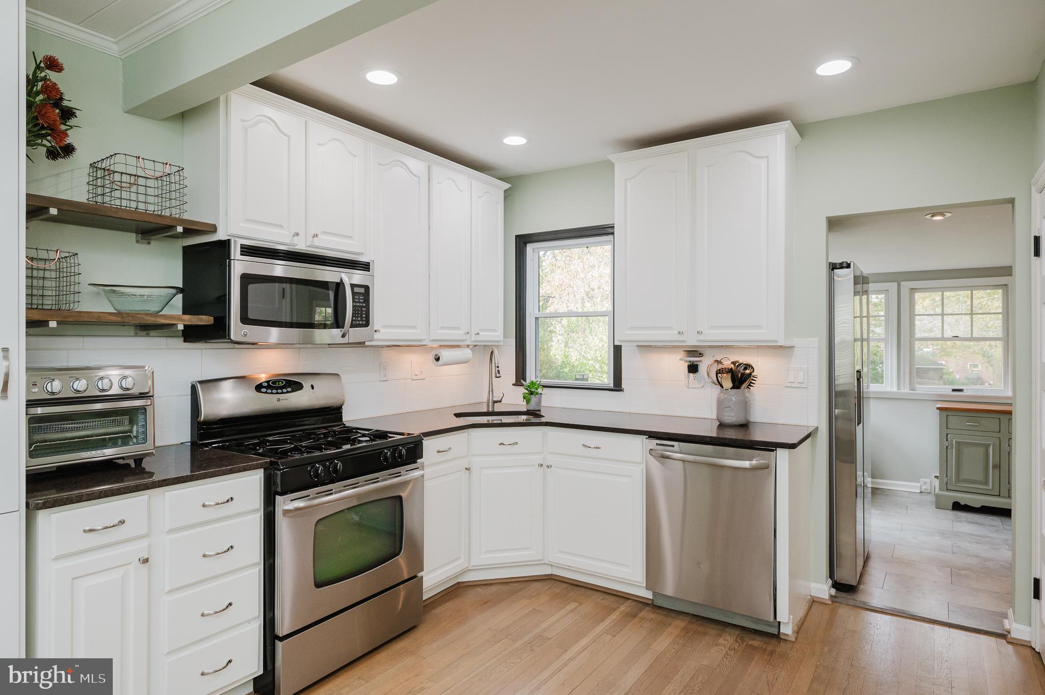 616 Sudbrook Road Baltimore, MD 21208 - Photo 17 of 58 a kitchen with granite countertop a sink and steel appliances