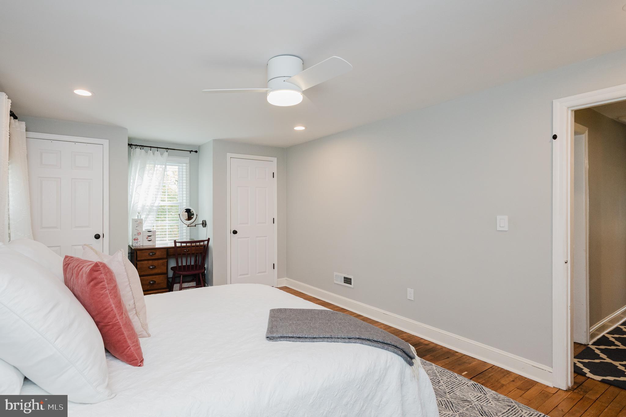 616 Sudbrook Road Baltimore, MD 21208 - Photo 32 of 58 a bedroom with a bed and a chandelier