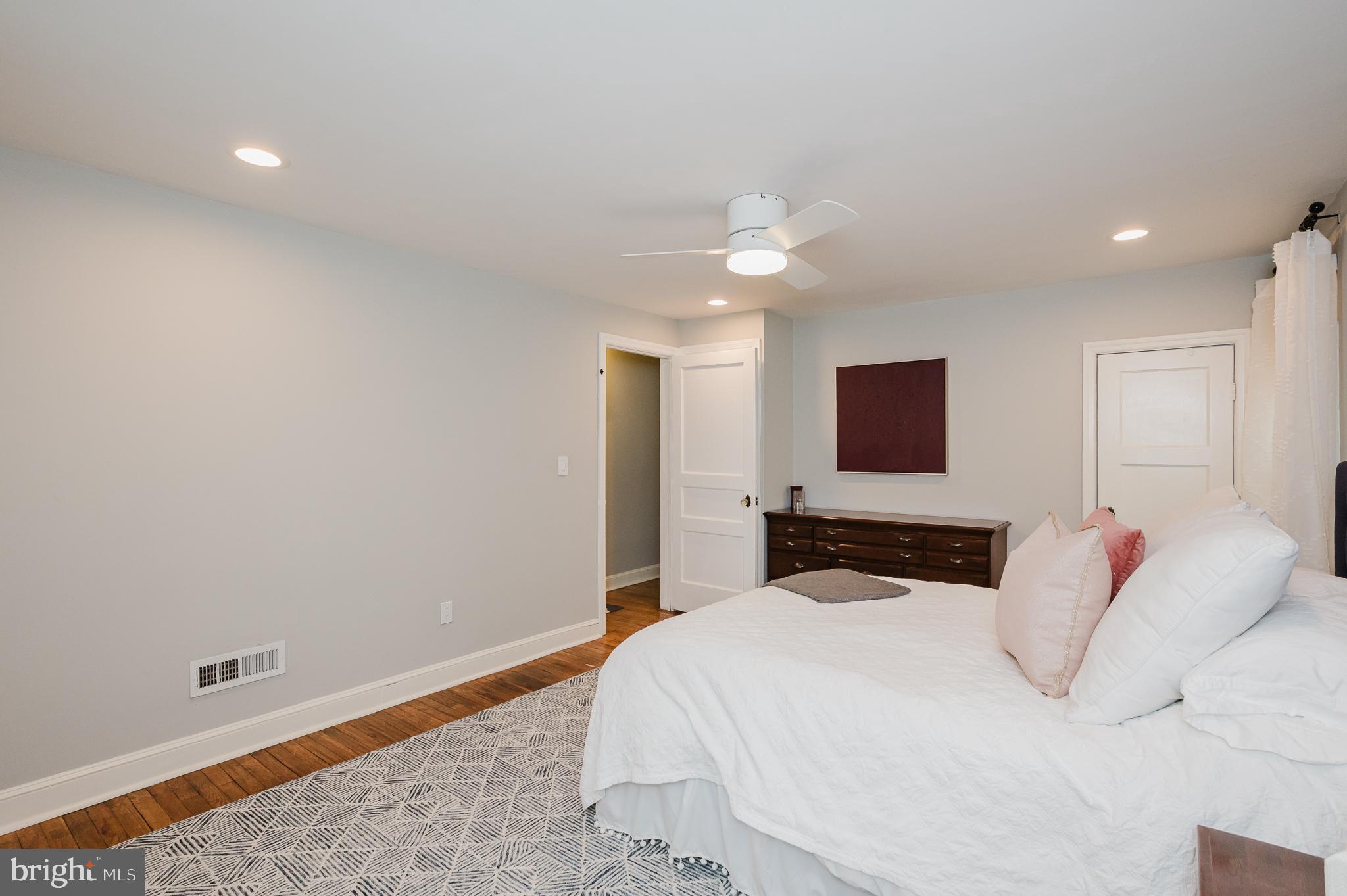616 Sudbrook Road Baltimore, MD 21208 - Photo 33 of 58 a bedroom with a bed and a flat screen tv