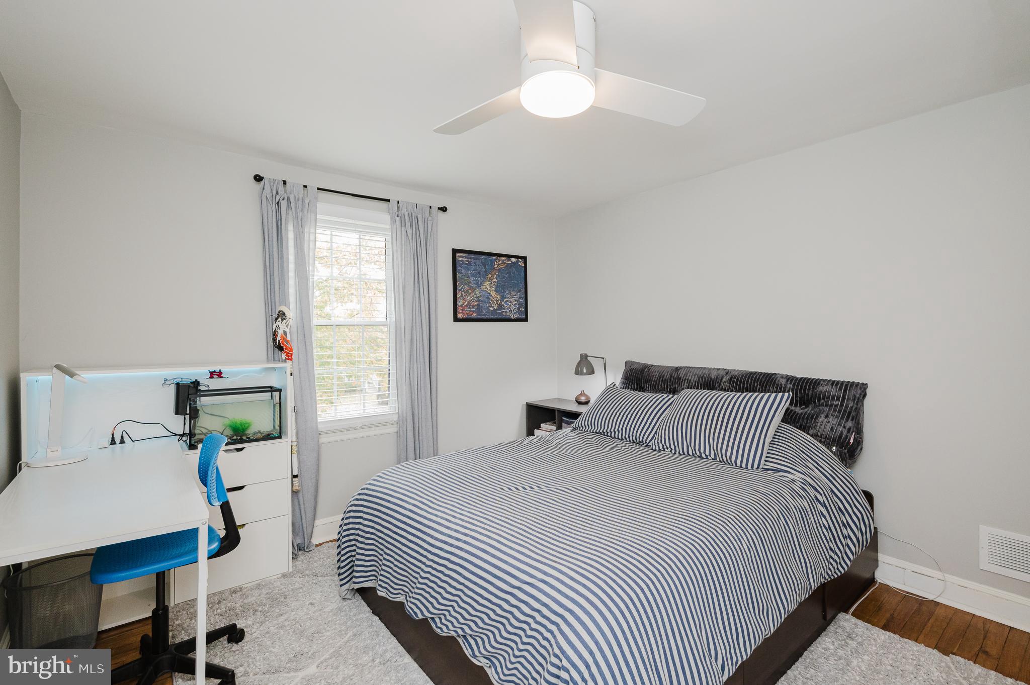 616 Sudbrook Road Baltimore, MD 21208 - Photo 35 of 58 a bedroom with a bed and a table