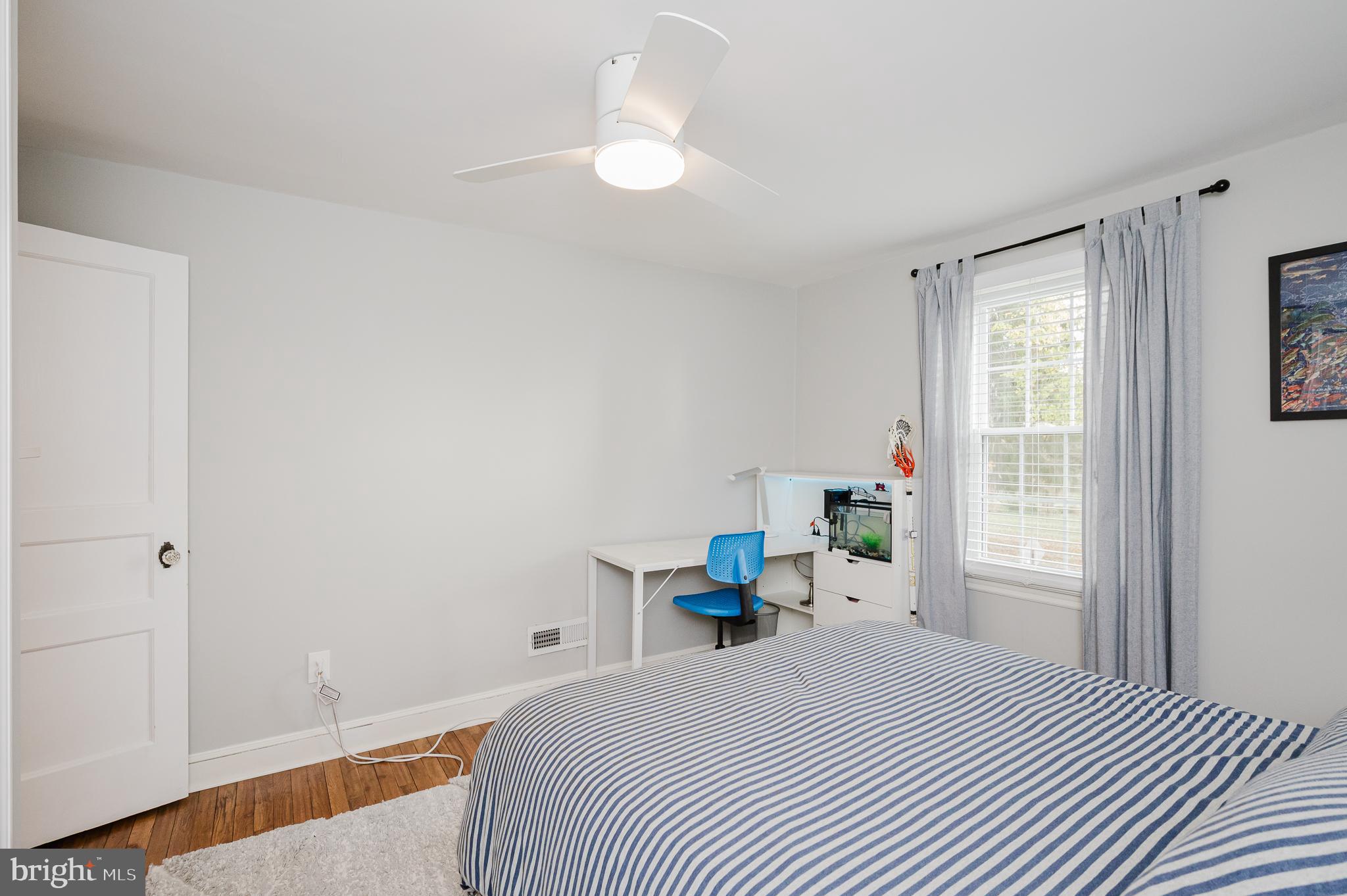 616 Sudbrook Road Baltimore, MD 21208 - Photo 36 of 58 a bedroom with a bed and a window