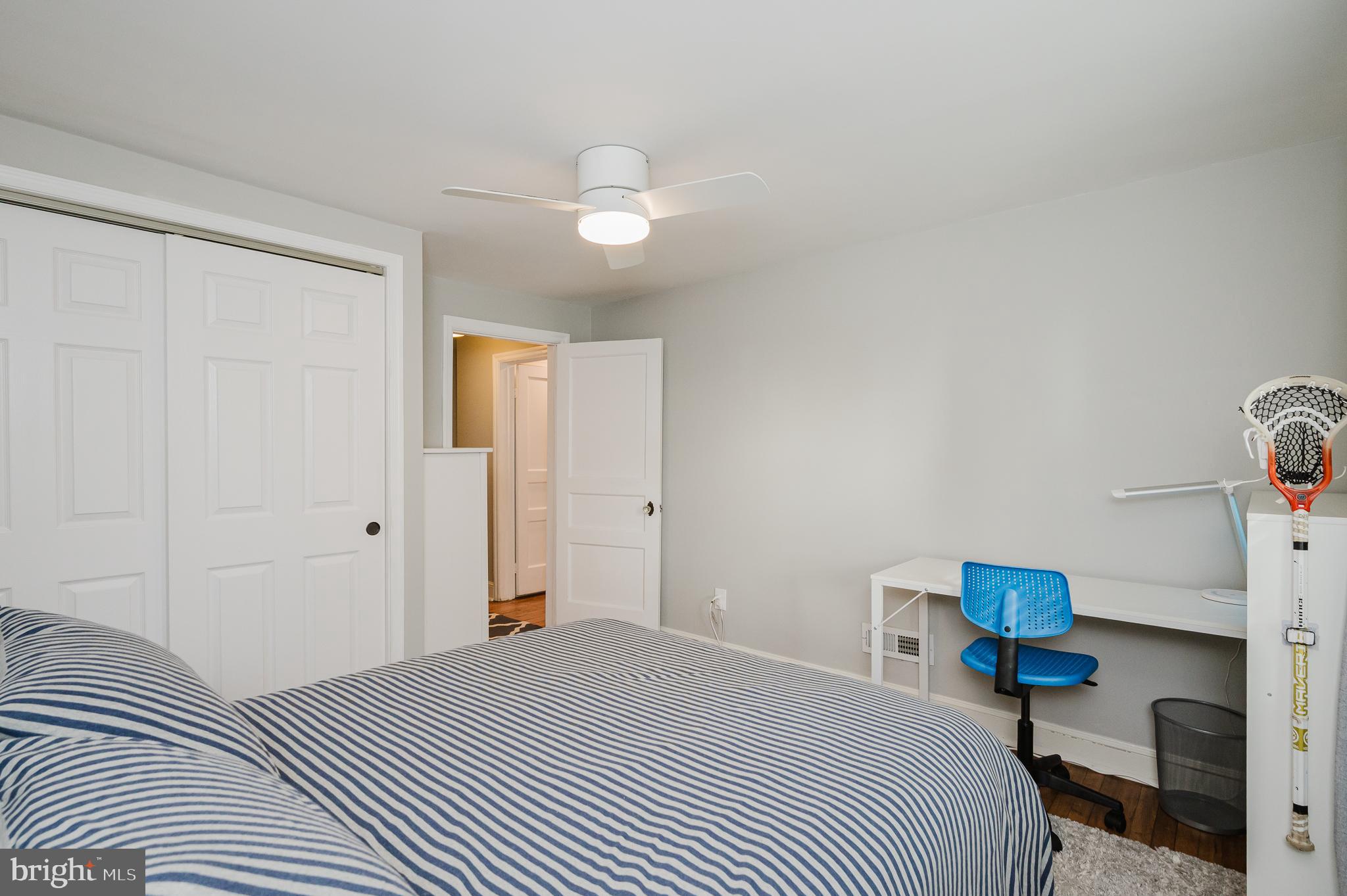 616 Sudbrook Road Baltimore, MD 21208 - Photo 37 of 58 a bedroom with a bed and a chandelier