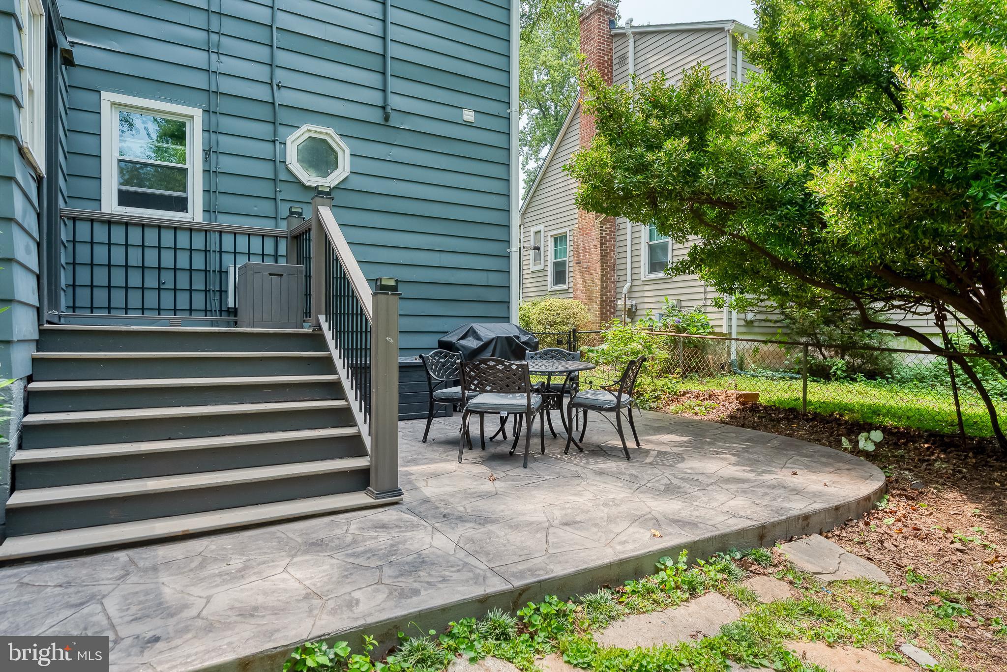 616 Sudbrook Road Baltimore, MD 21208 - Photo 44 of 58 a view of a chairs and table in backyard of the house