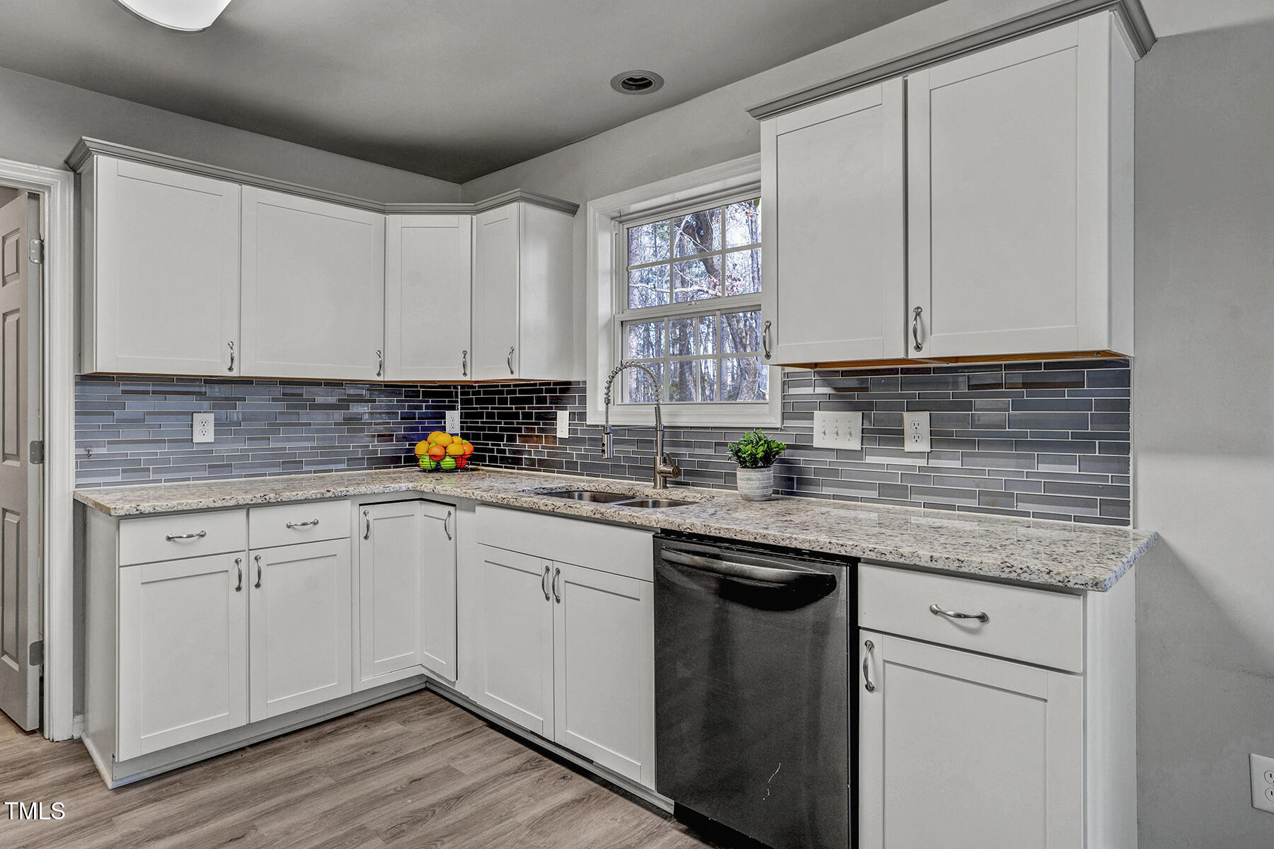 1506 Poplar Ridge Road Fuquay-Varina, NC 27526 - Photo 14 of 29 a kitchen with stainless steel appliances granite countertop a sink and cabinets