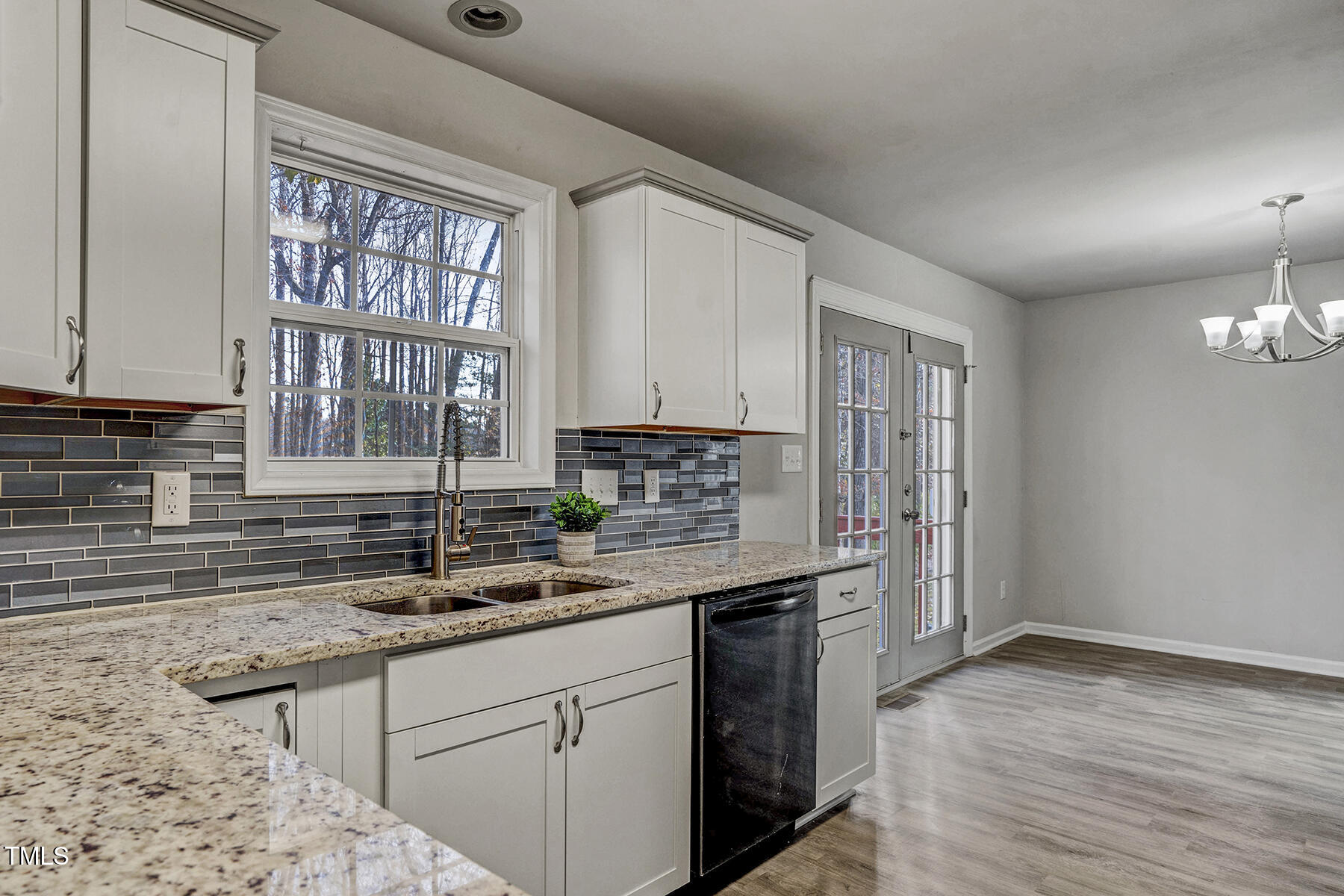 1506 Poplar Ridge Road Fuquay-Varina, NC 27526 - Photo 15 of 29 a kitchen with a sink cabinets and window