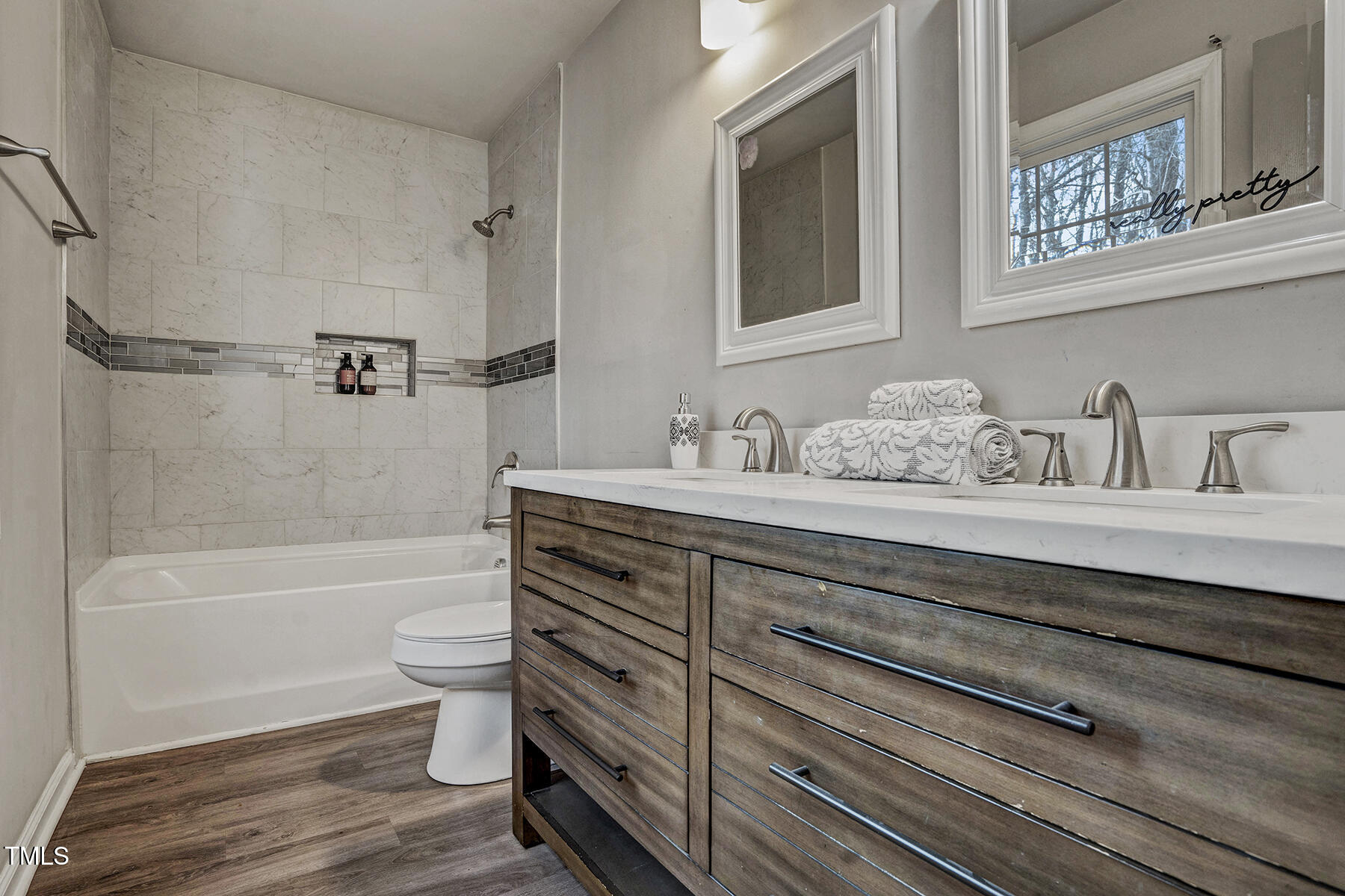 1506 Poplar Ridge Road Fuquay-Varina, NC 27526 - Photo 20 of 29 a bathroom with a sink a toilet and bathtub