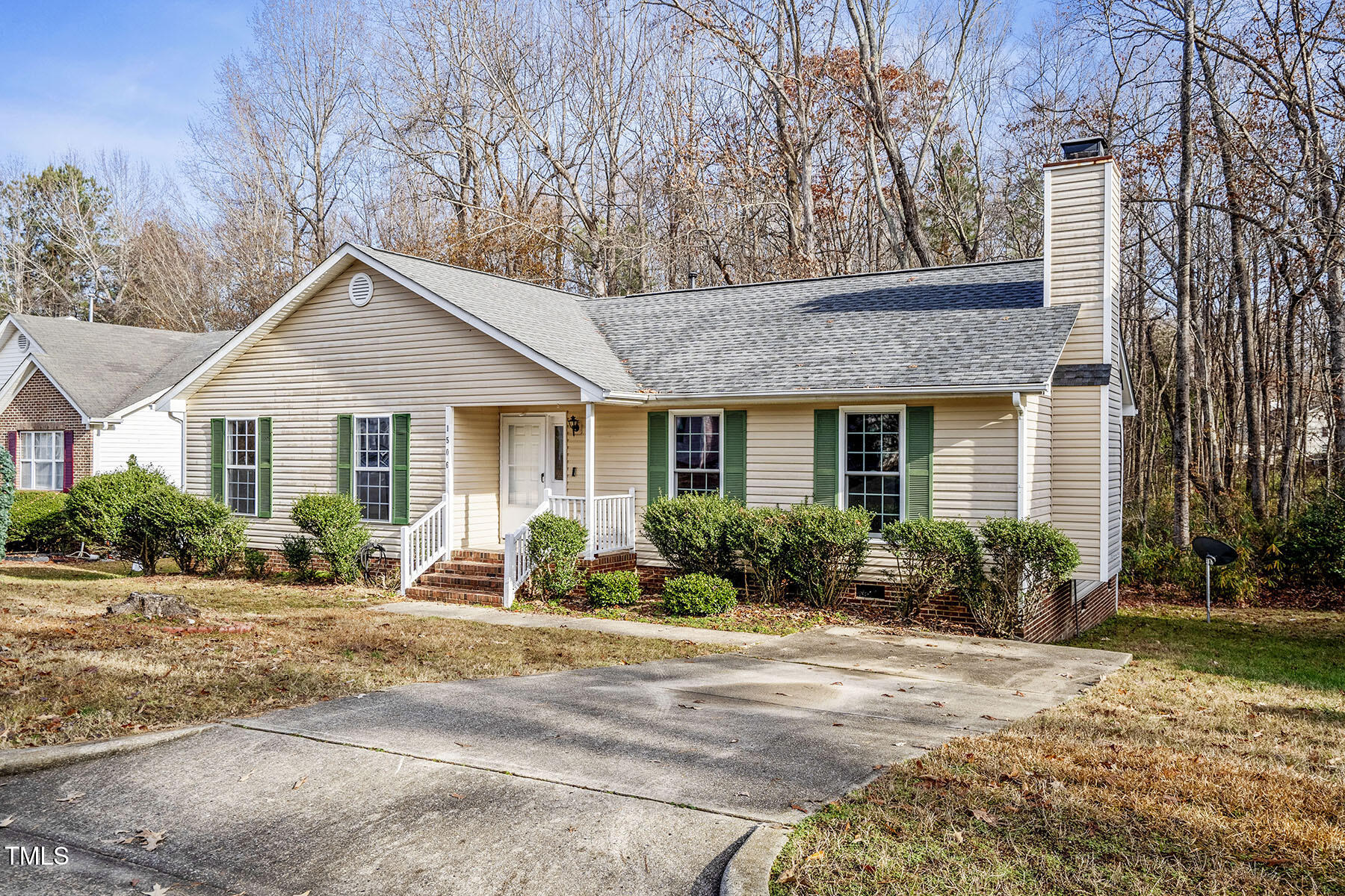 1506 Poplar Ridge Road Fuquay-Varina, NC 27526 - Photo 2 of 29 a front view of a house with lots of windows and outdoor seating