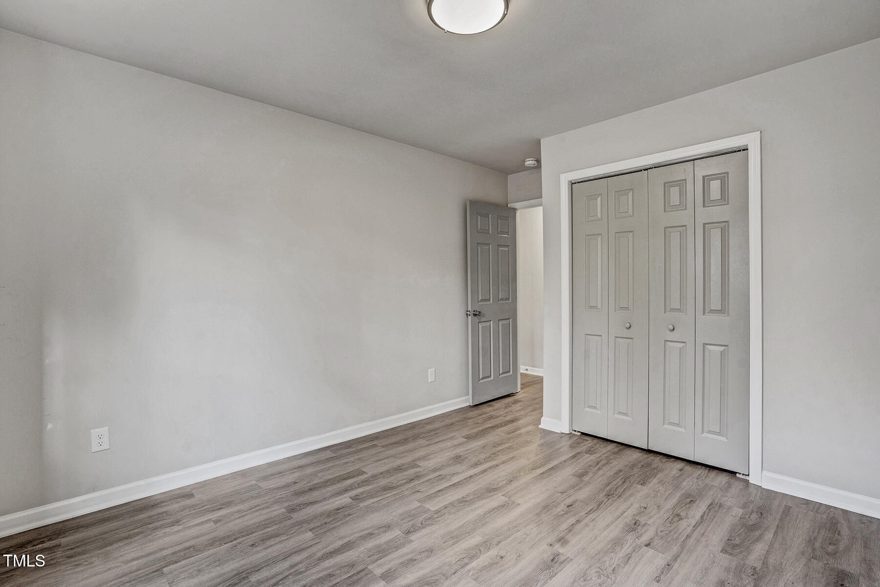1506 Poplar Ridge Road Fuquay-Varina, NC 27526 - Photo 22 of 29 a view of an empty room and wooden floor