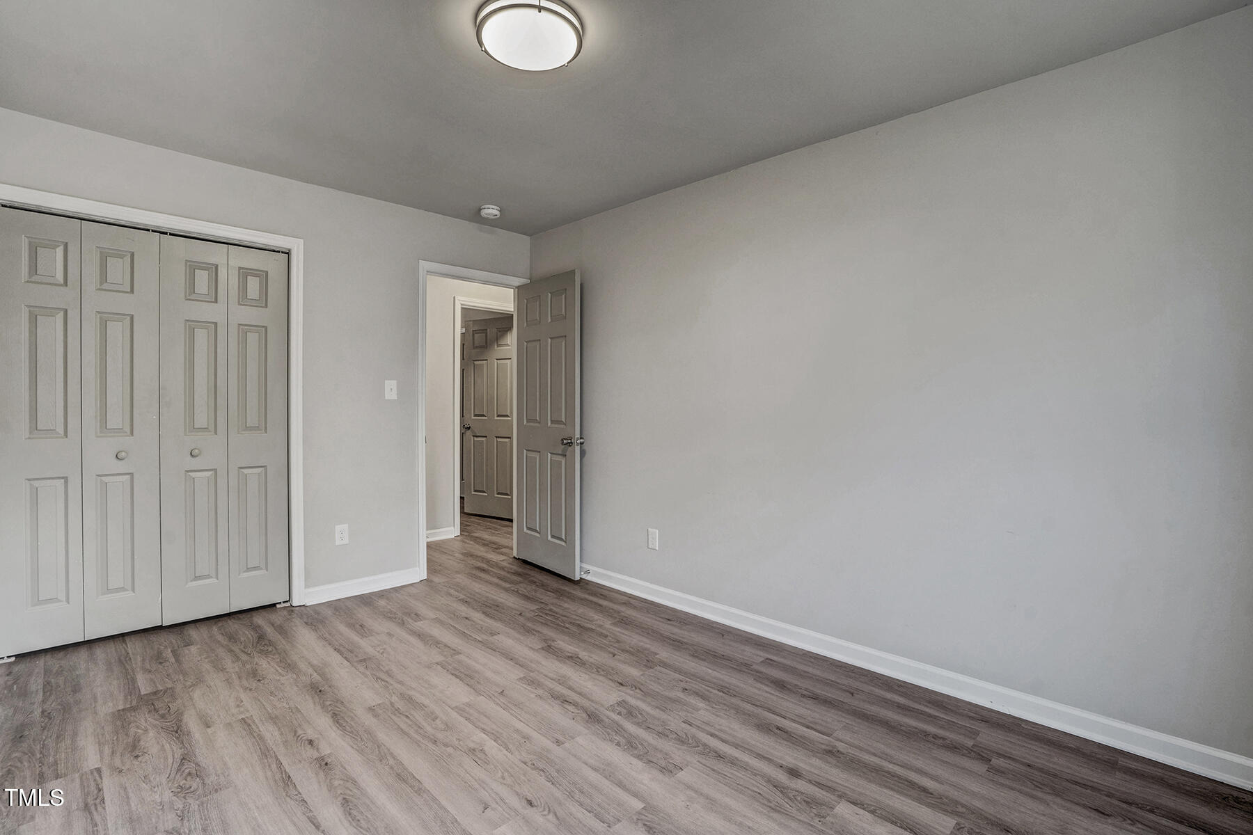 1506 Poplar Ridge Road Fuquay-Varina, NC 27526 - Photo 24 of 29 a view of an empty room and wooden floor