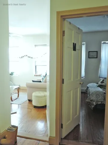 a bedroom with furniture and a book shelf