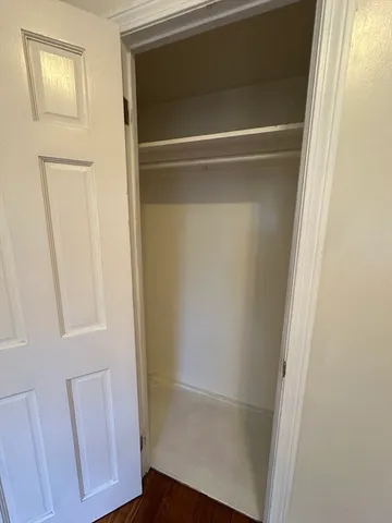 a kitchen with granite countertop stainless steel appliances a stove a refrigerator a sink and cabinets