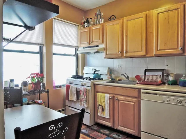 a living room with furniture and flat screen tv
