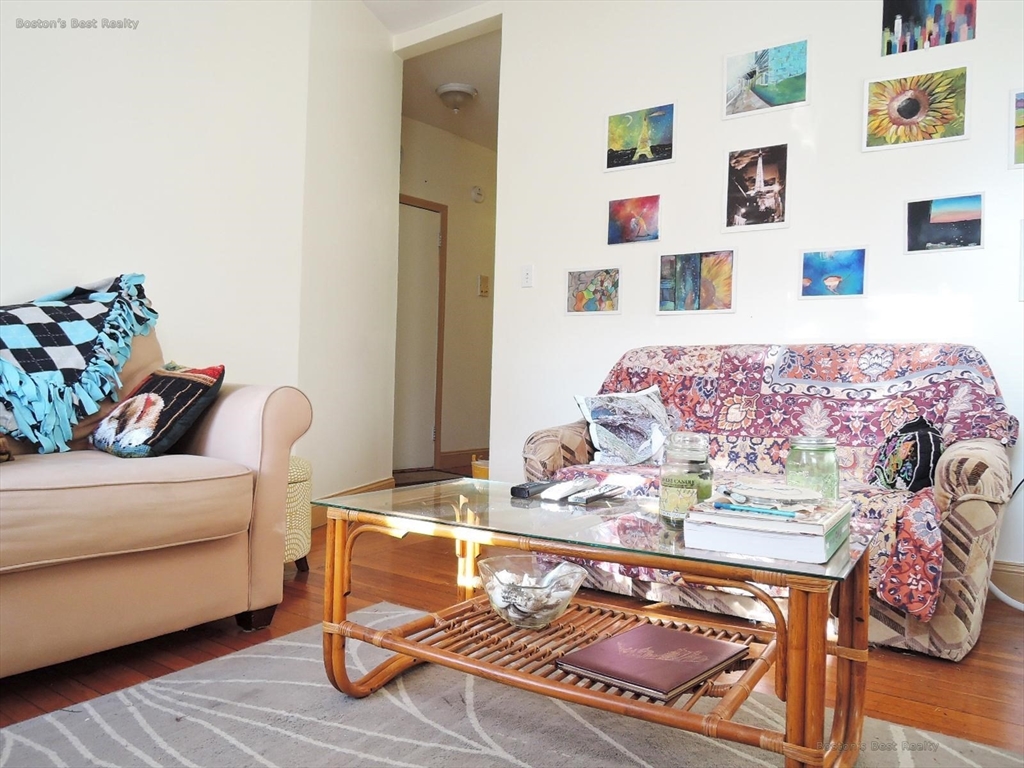 181 Allston, Unit 2 Boston, MA 02134 - Photo 8 of 18 a living room with furniture and flat screen tv