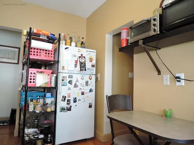 a bathroom with a sink a toilet and shower curtain