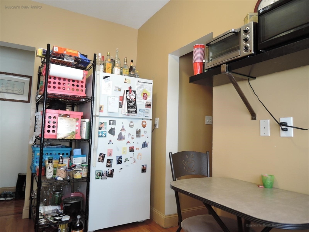 181 Allston, Unit 2 Boston, MA 02134 - Photo 10 of 18 a view of a room with furniture and toys