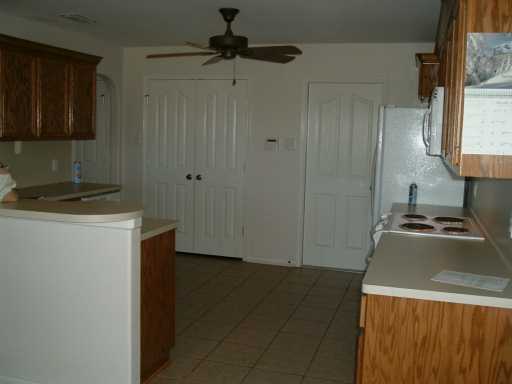 2429 Handlin Drive Corpus Christi, TX 78418 - Photo 3 of 9 a kitchen with a stove and a refrigerator