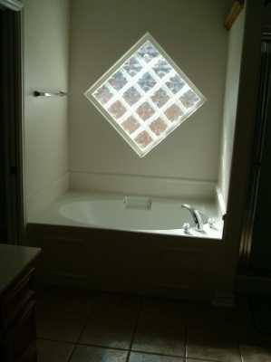 2429 Handlin Drive Corpus Christi, TX 78418 - Photo 5 of 9 a bathroom with a sink and a window