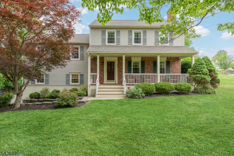 79 Main Street Califon, NJ 07830 - Photo 1 of 50 a front view of a house with a garden