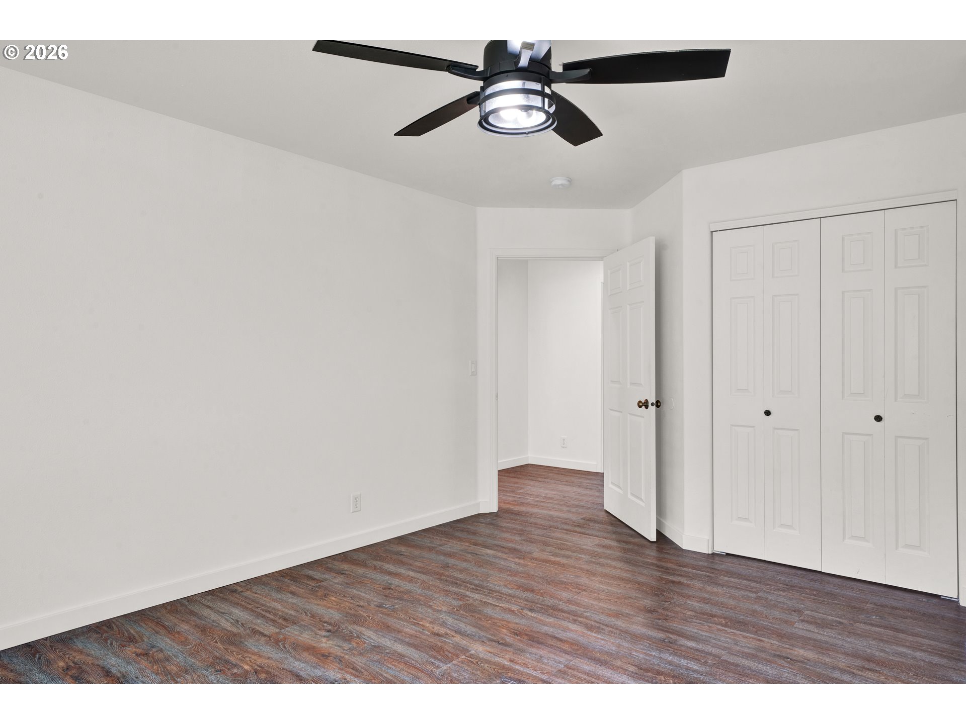 85675 Glenada Road Florence, OR 97439 - Photo 27 of 42 a view of an empty room with wooden floor