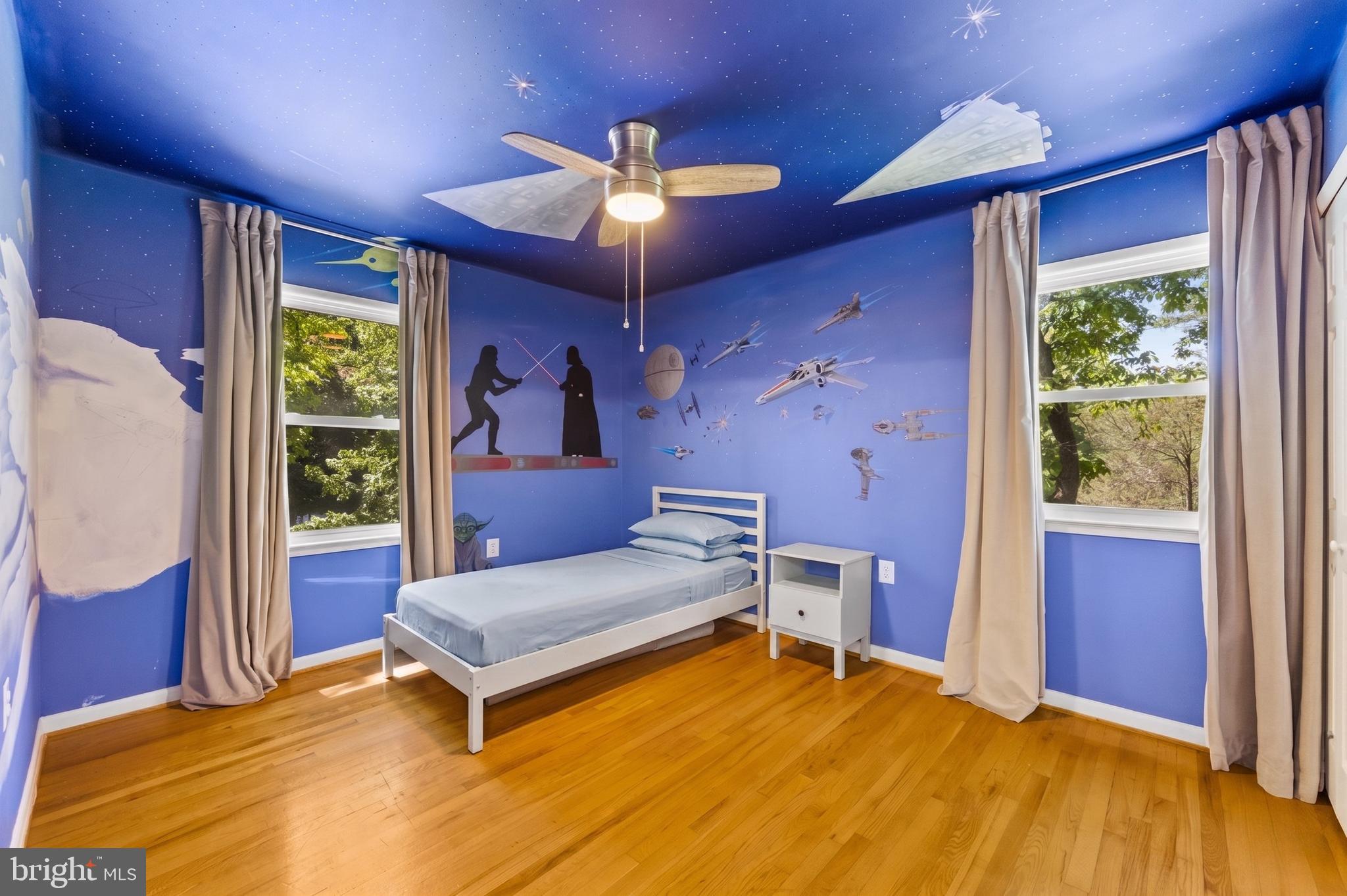 11019 Ring Road Reston, VA 20190 - Photo 45 of 78 a bedroom with a bed and a chandelier