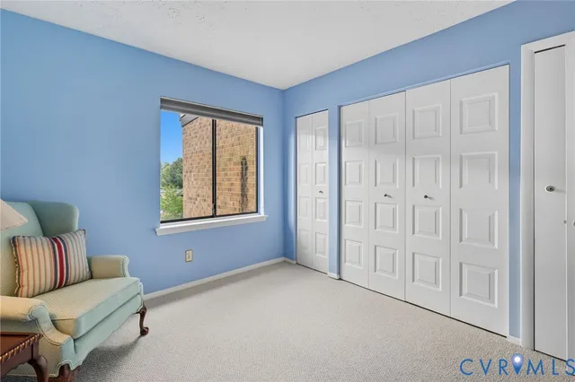 a view of livingroom with furniture and windows