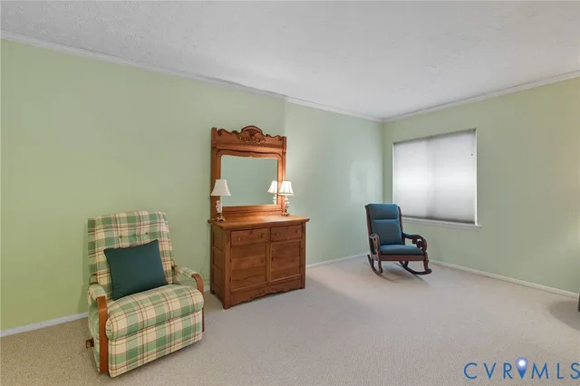 a living room with furniture and a mirror