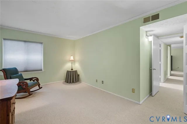 a bedroom with a bed and a lamp