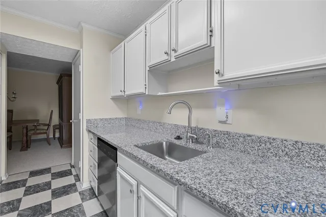 a kitchen with stainless steel appliances granite countertop a sink and cabinets