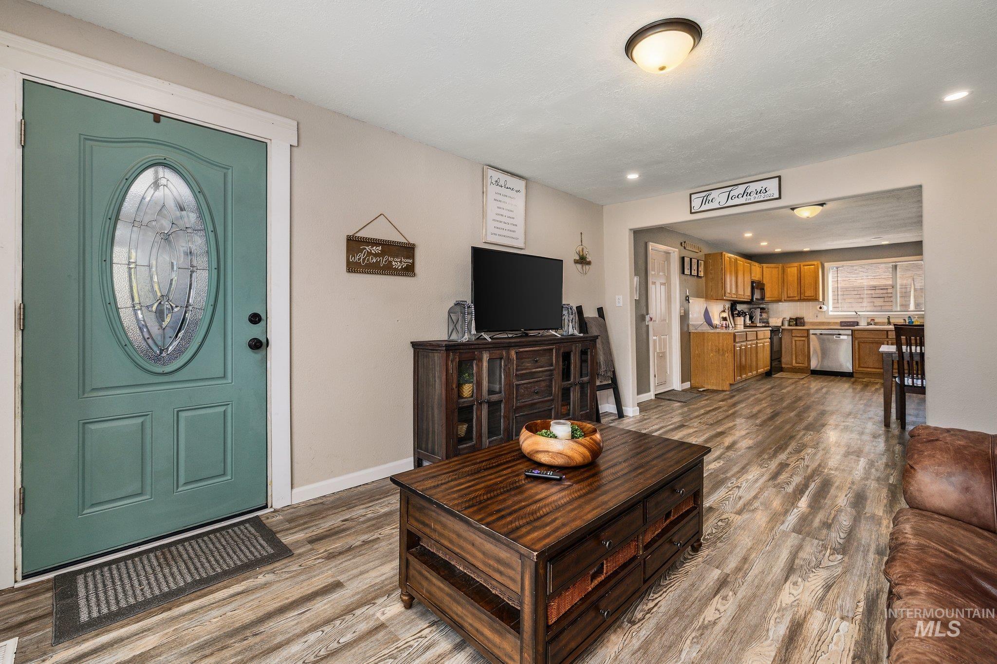1504 2nd Street North Nampa, ID 83687 - Photo 4 of 29 Living area with dark wood-type flooring and recessed lighting