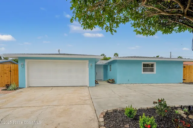 a front view of a house with a garage