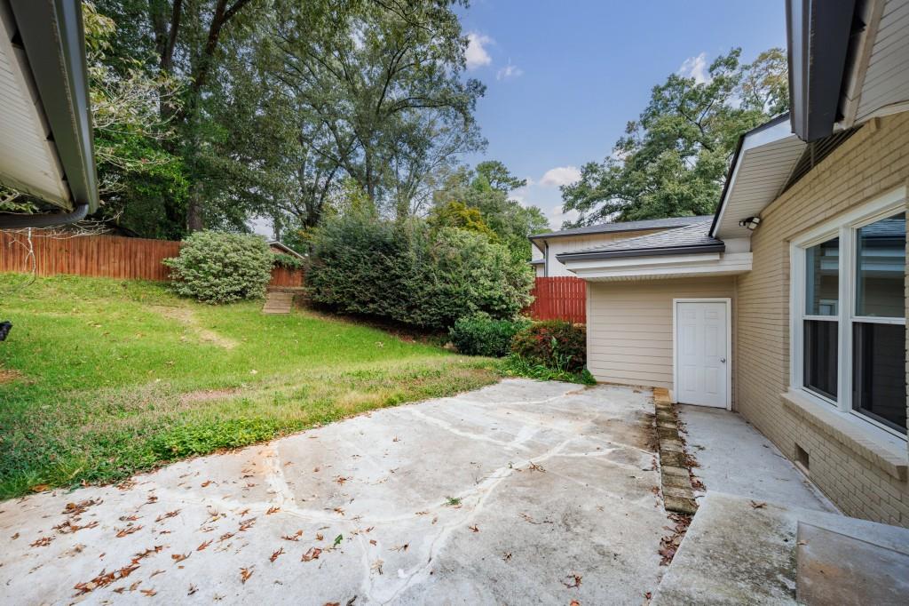 3838 Longview Drive Chamblee, GA 30341 - Photo 13 of 45 a view of a house with a yard and garage