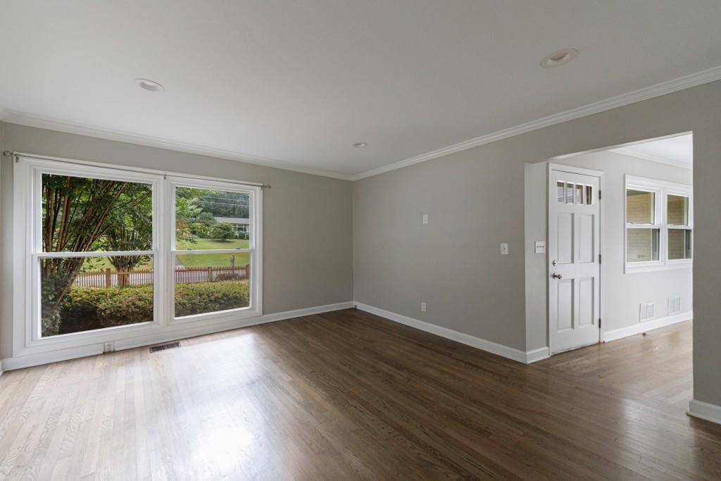 3838 Longview Drive Chamblee, GA 30341 - Photo 14 of 45 a view of an empty room with wooden floor and a window