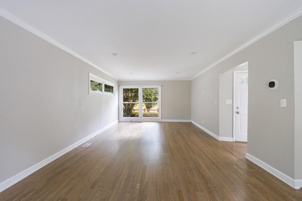 3838 Longview Drive Chamblee, GA 30341 - Photo 15 of 45 a view of an empty room with wooden floor and a window