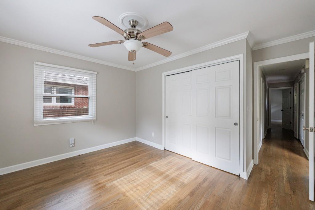 3838 Longview Drive Chamblee, GA 30341 - Photo 25 of 45 a view of a big room with wooden floor and windows