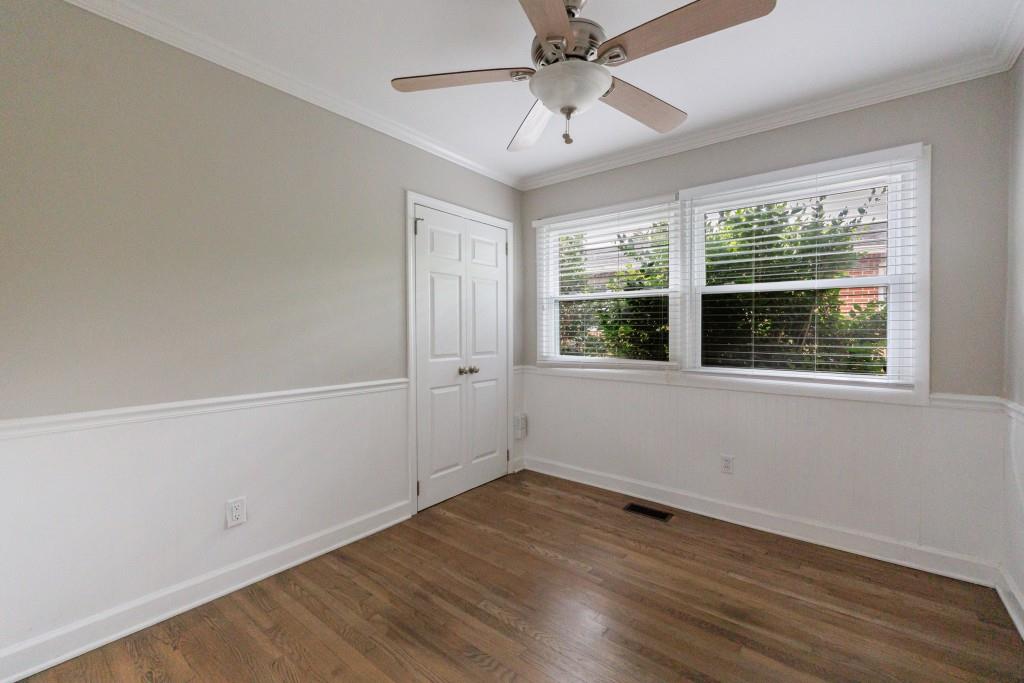 3838 Longview Drive Chamblee, GA 30341 - Photo 27 of 45 wooden floor in an empty room with a window