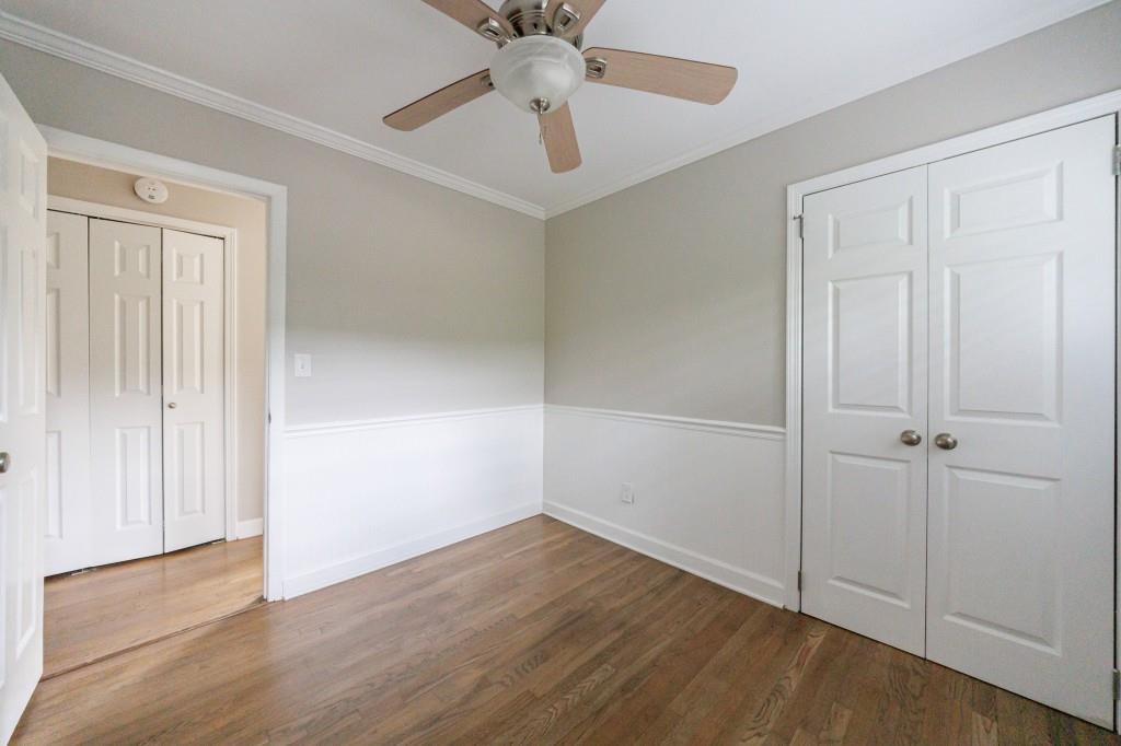 3838 Longview Drive Chamblee, GA 30341 - Photo 28 of 45 an empty room with a hardwood and ceiling fan