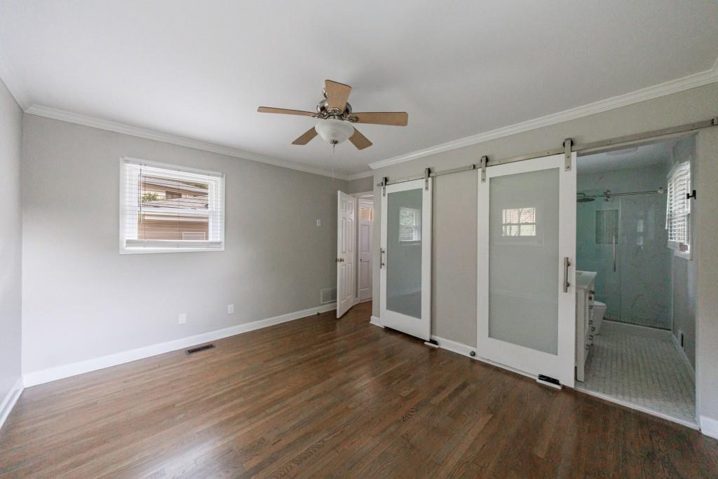 3838 Longview Drive Chamblee, GA 30341 - Photo 30 of 45 a view of an empty room with wooden floor and window