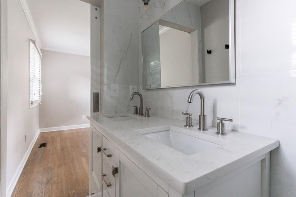 3838 Longview Drive Chamblee, GA 30341 - Photo 32 of 45 a bathroom with a sink and a mirror