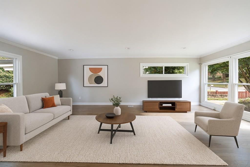 3838 Longview Drive Chamblee, GA 30341 - Photo 4 of 45 a living room with furniture and a large window