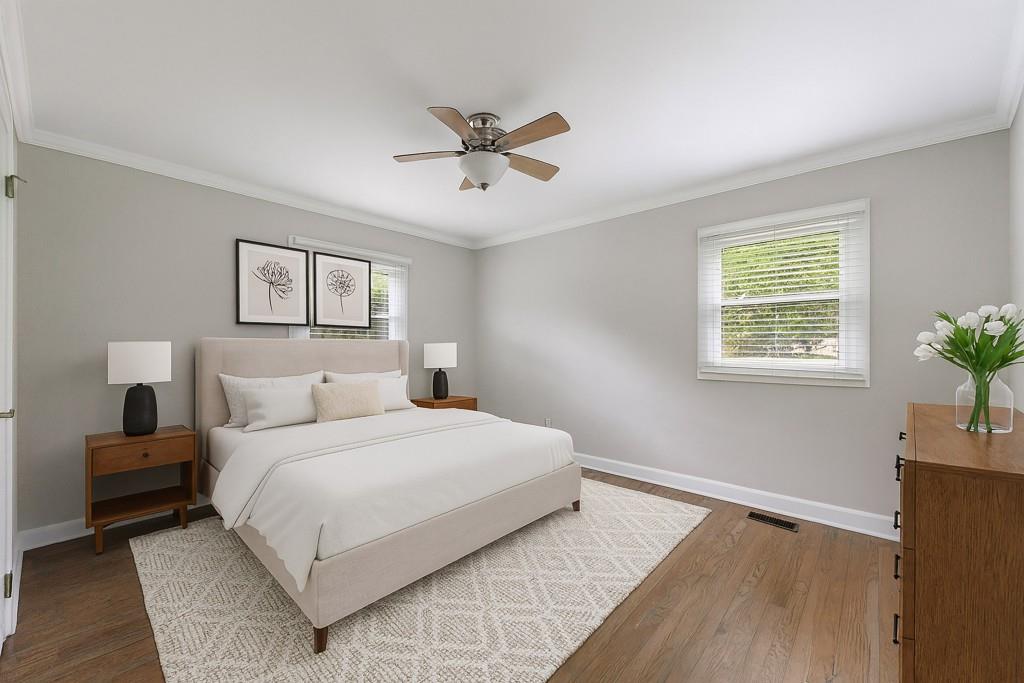 3838 Longview Drive Chamblee, GA 30341 - Photo 6 of 45 a bedroom with a large bed and a window