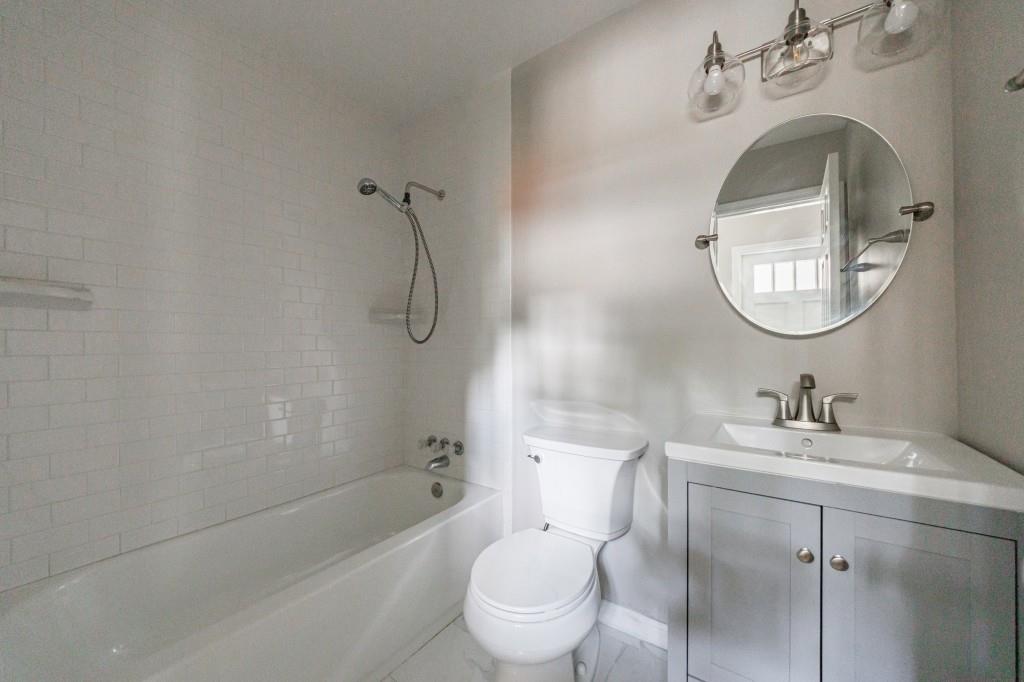3838 Longview Drive Chamblee, GA 30341 - Photo 9 of 45 a bathroom with a sink toilet and shower