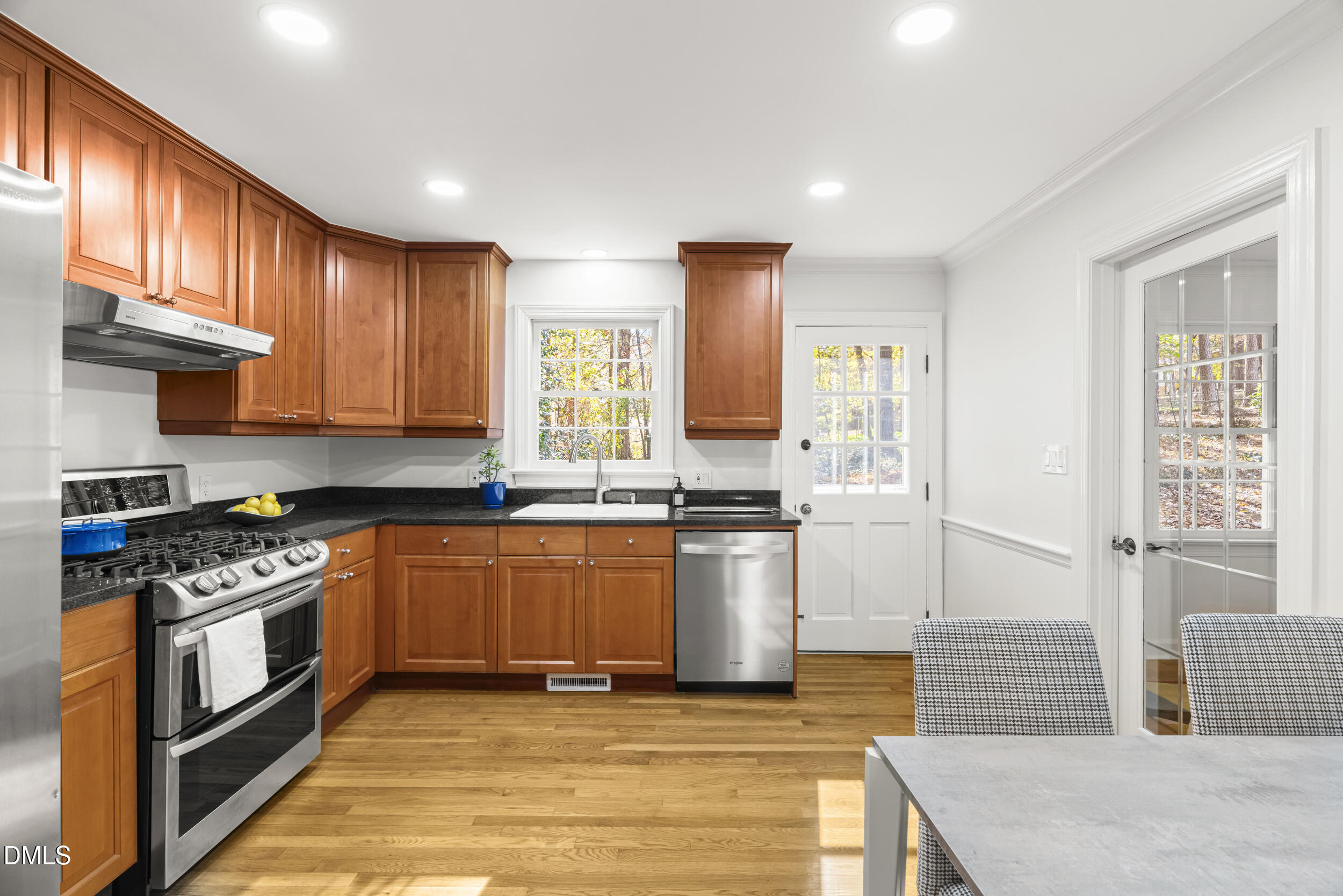 2105 Yorkgate Drive Raleigh, NC 27612 - Photo 12 of 42 a kitchen with stainless steel appliances granite countertop a stove a sink dishwasher and a refrigerator