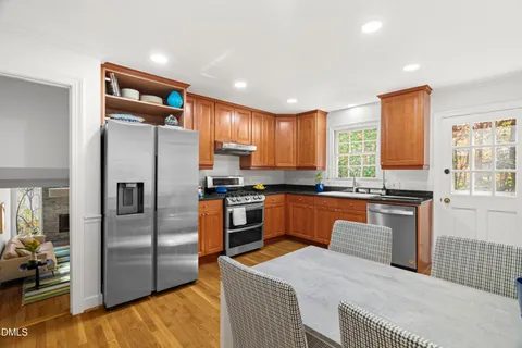 a very nice looking dining room with a table and chairs