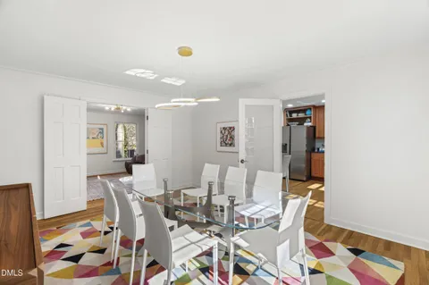 a white toilet sitting next to a bath tub