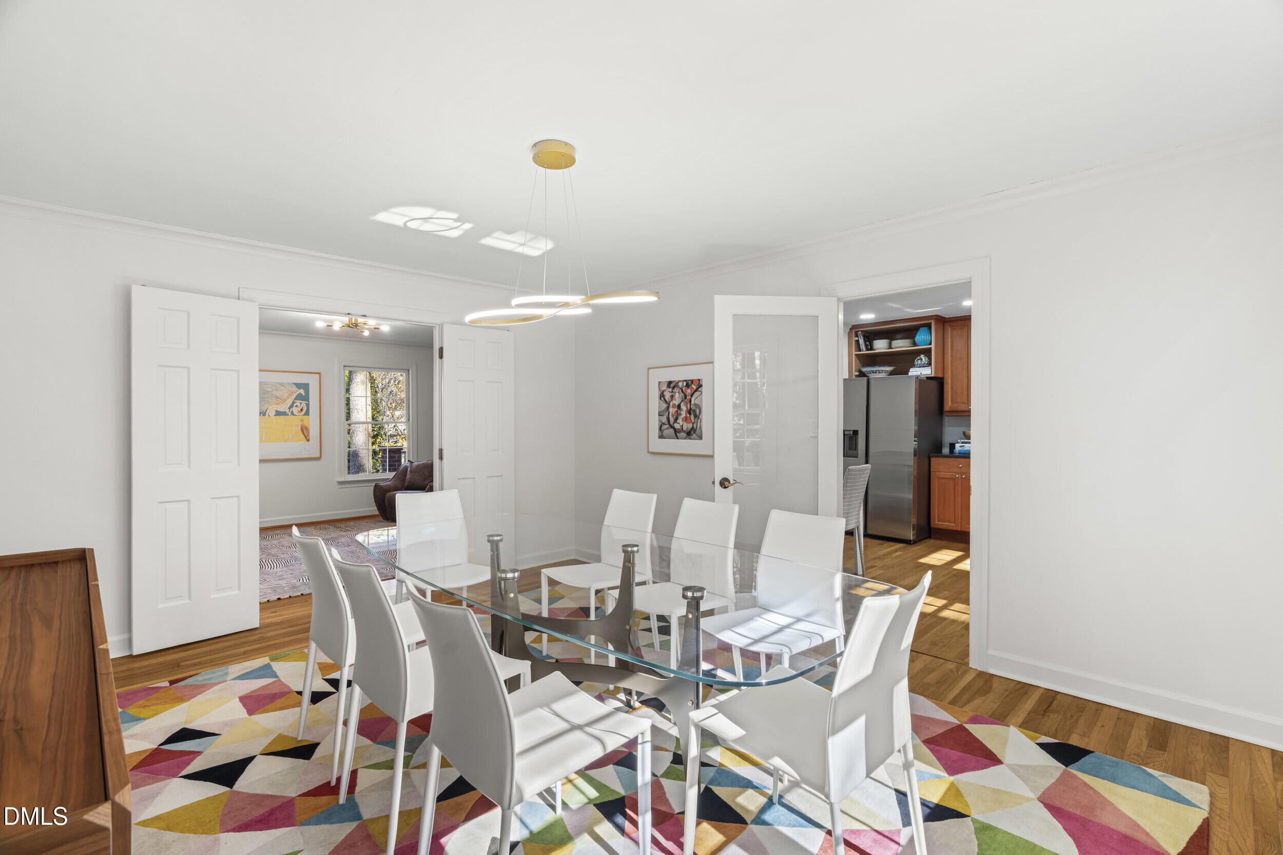 2105 Yorkgate Drive Raleigh, NC 27612 - Photo 16 of 42 a view of a dining room with furniture and wooden floor