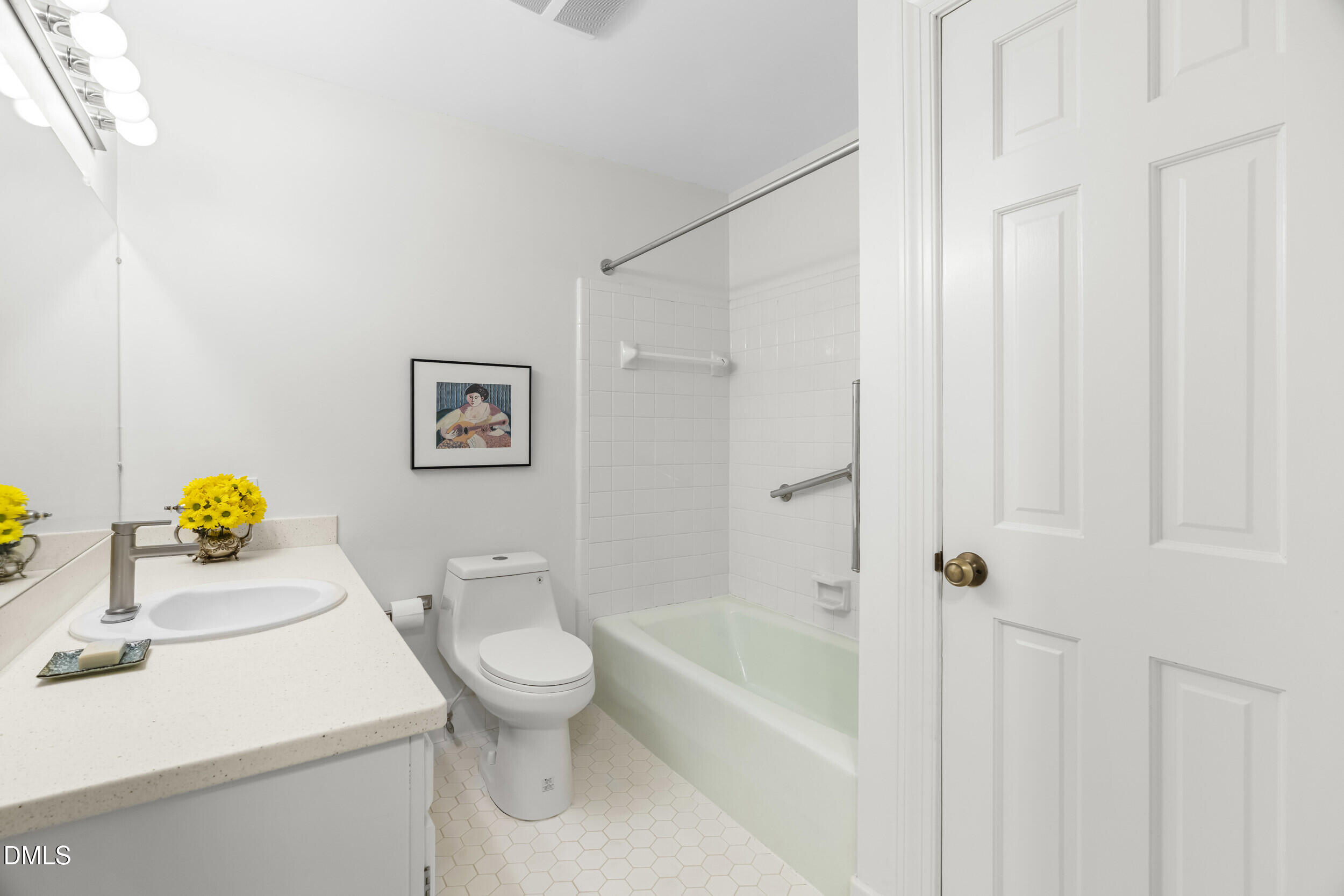 2105 Yorkgate Drive Raleigh, NC 27612 - Photo 17 of 42 a white toilet sitting next to a bath tub
