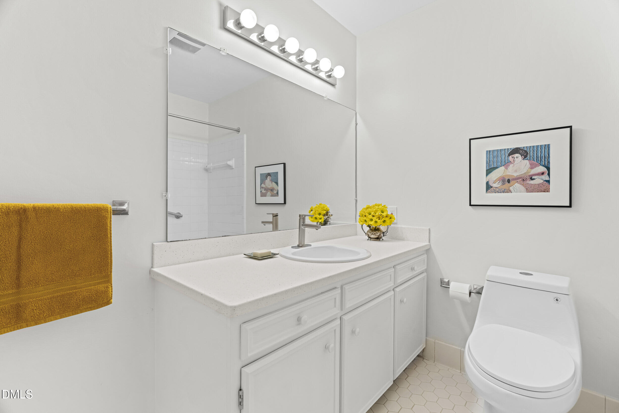 2105 Yorkgate Drive Raleigh, NC 27612 - Photo 18 of 42 a bathroom with a sink a toilet and mirror
