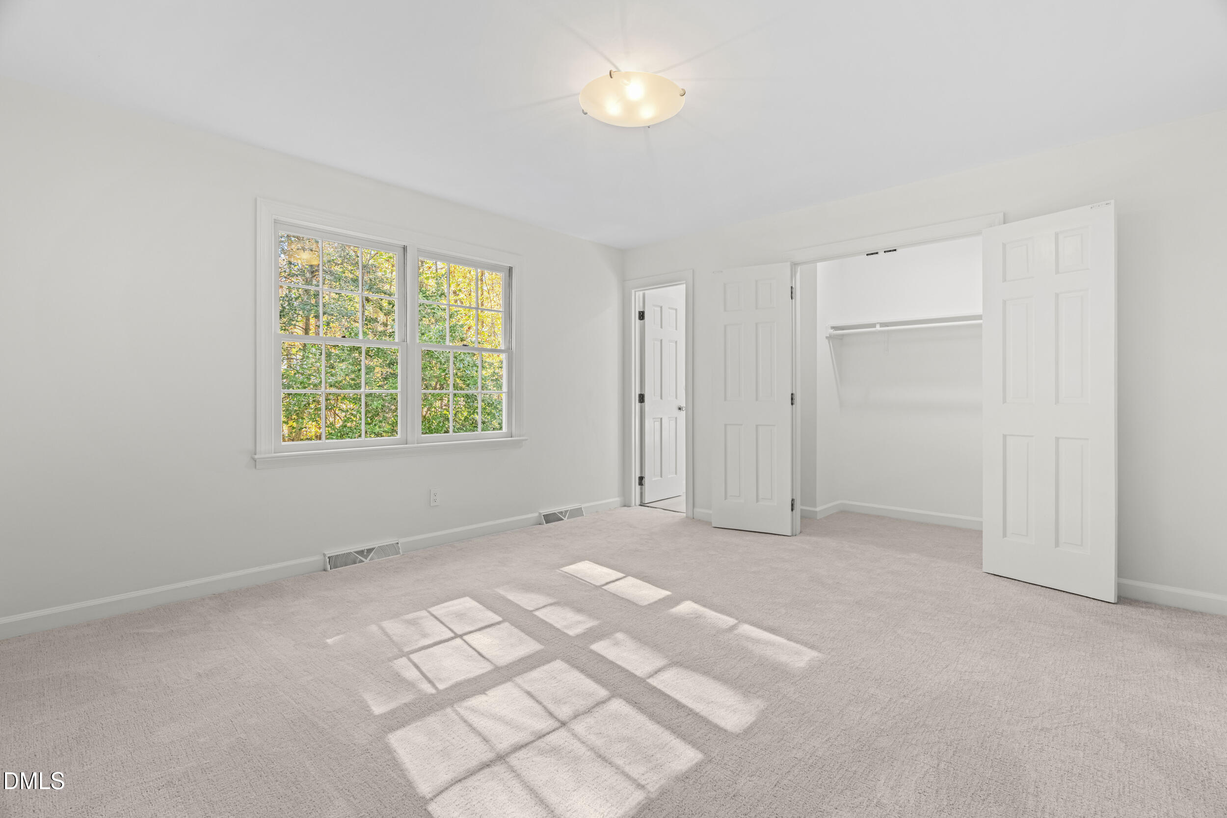 2105 Yorkgate Drive Raleigh, NC 27612 - Photo 19 of 42 an empty room with windows